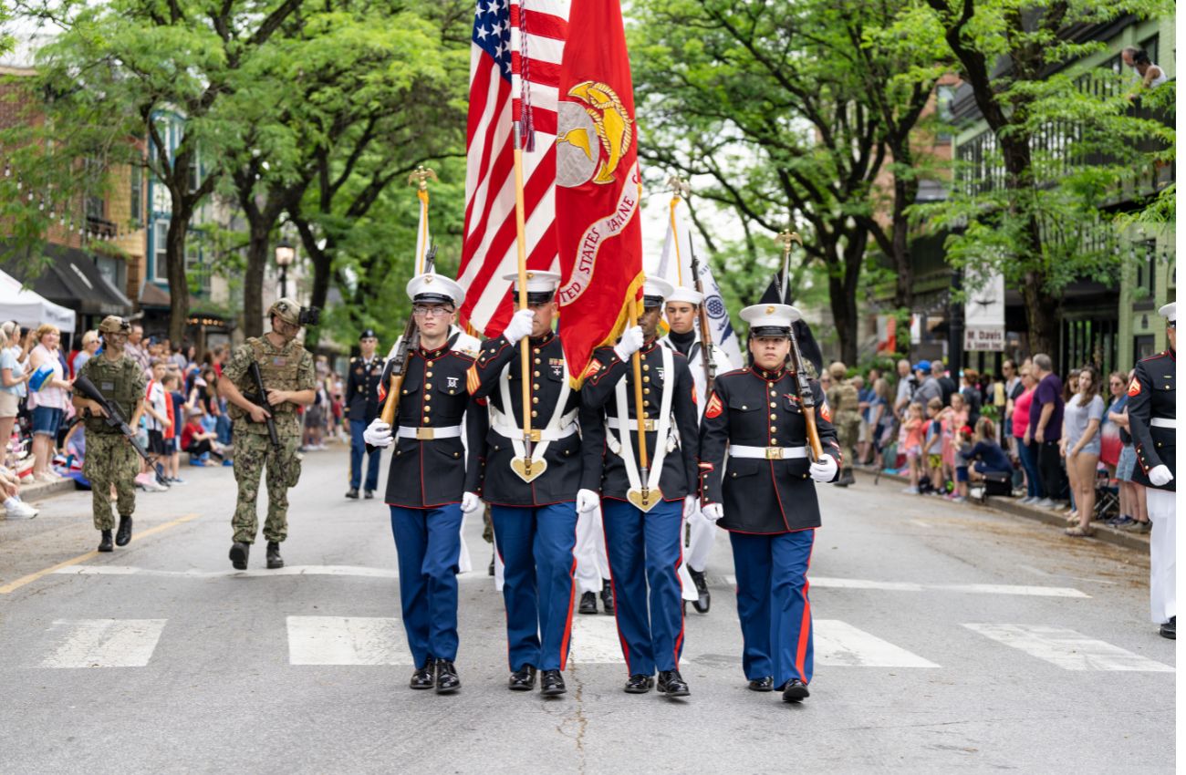 Marines march in a patriotic display on Memorial Day on the Main Line