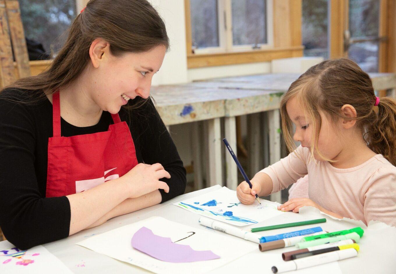 Claudia and Young Girl Drawing