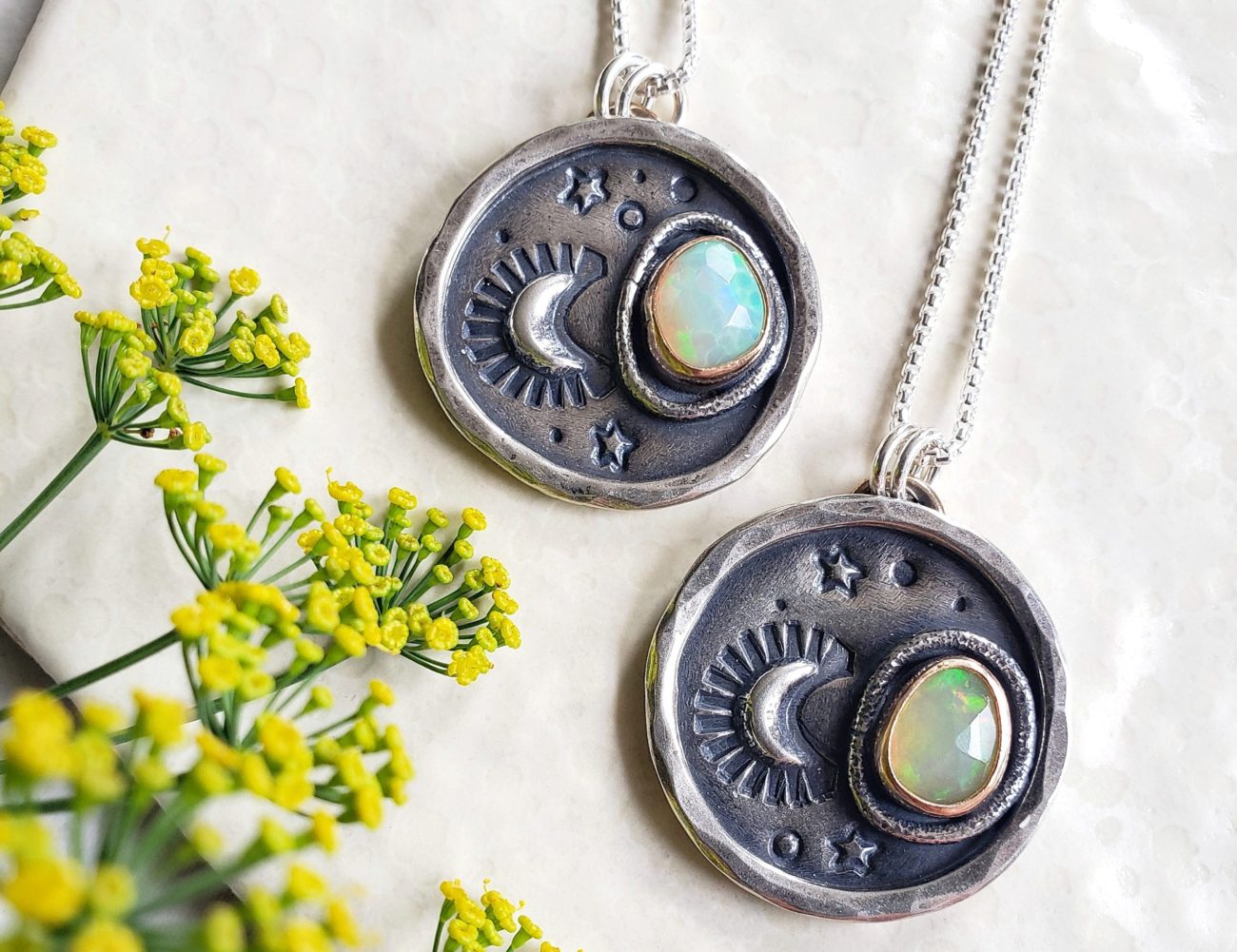 Two silver Night and Sky opal necklaces by Ten Air Studios.