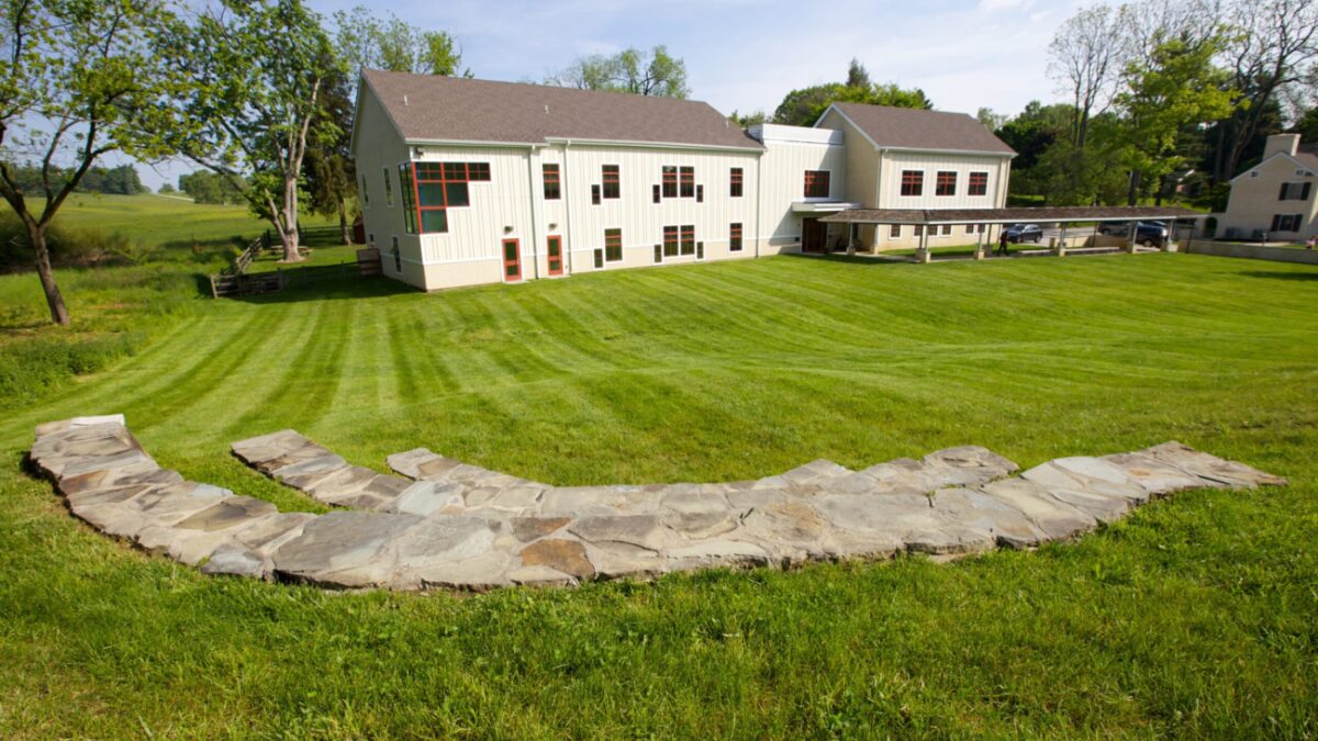 School building and large yard.