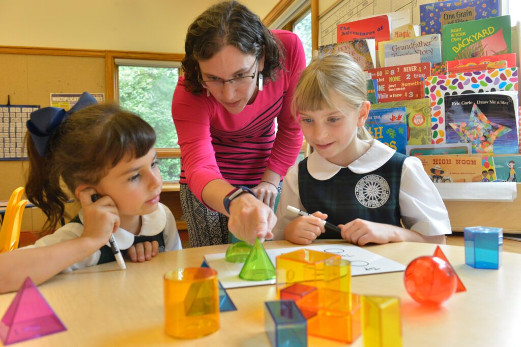 students learning with colored blocks at mlca