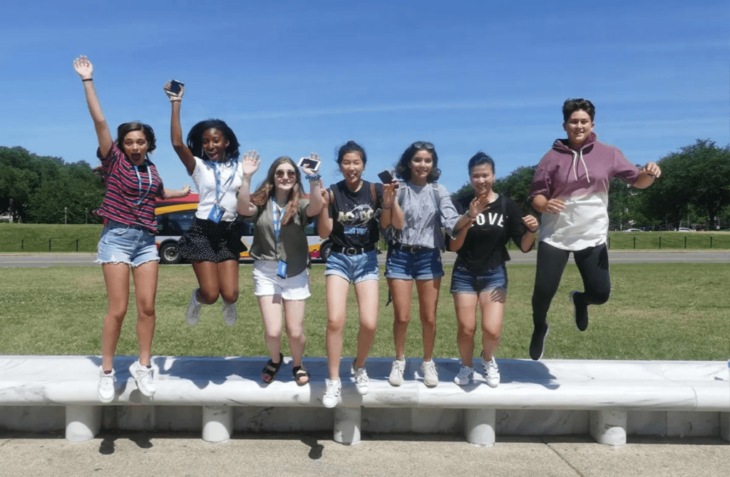Teens jumping and having fun at Summer Discovery Camp, a sleepaway camp experience at premier universities.