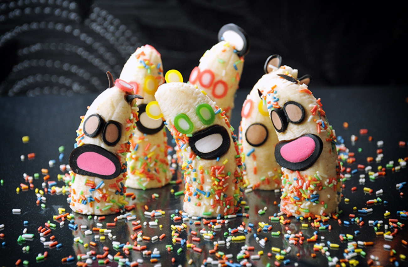 Banana halves with faces and confetti. The Candy Lab offers creative summer camps. 