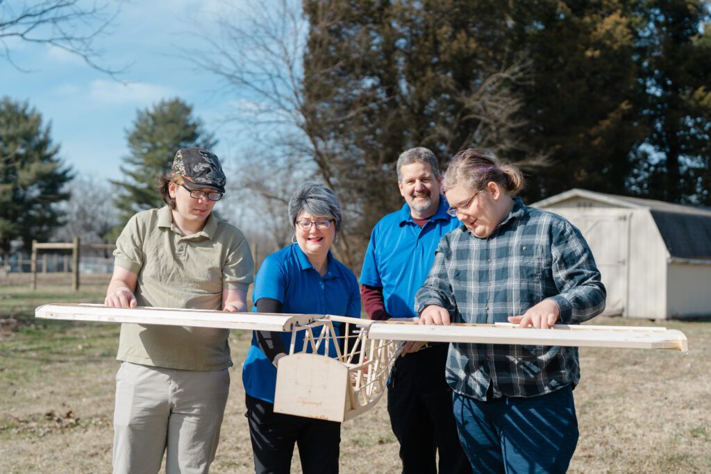 Family holiding a flying apparatus