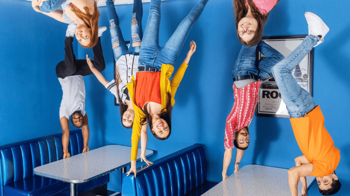 It looks like people are standing on the ceiling at the Museum of Illusions, a unique museum.