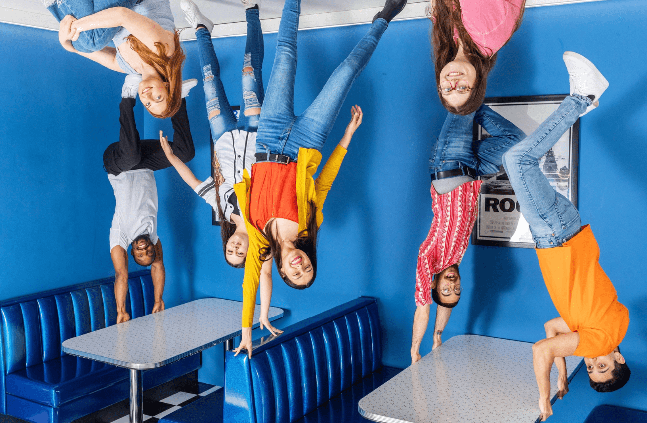 It looks like people are standing on the ceiling at the Museum of Illusions, a unique museum.