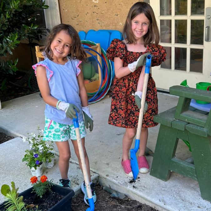 two children gardening