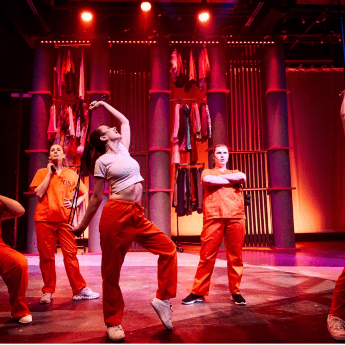 A group of young women on stage during a winter theatre production at SALT performing arts.
