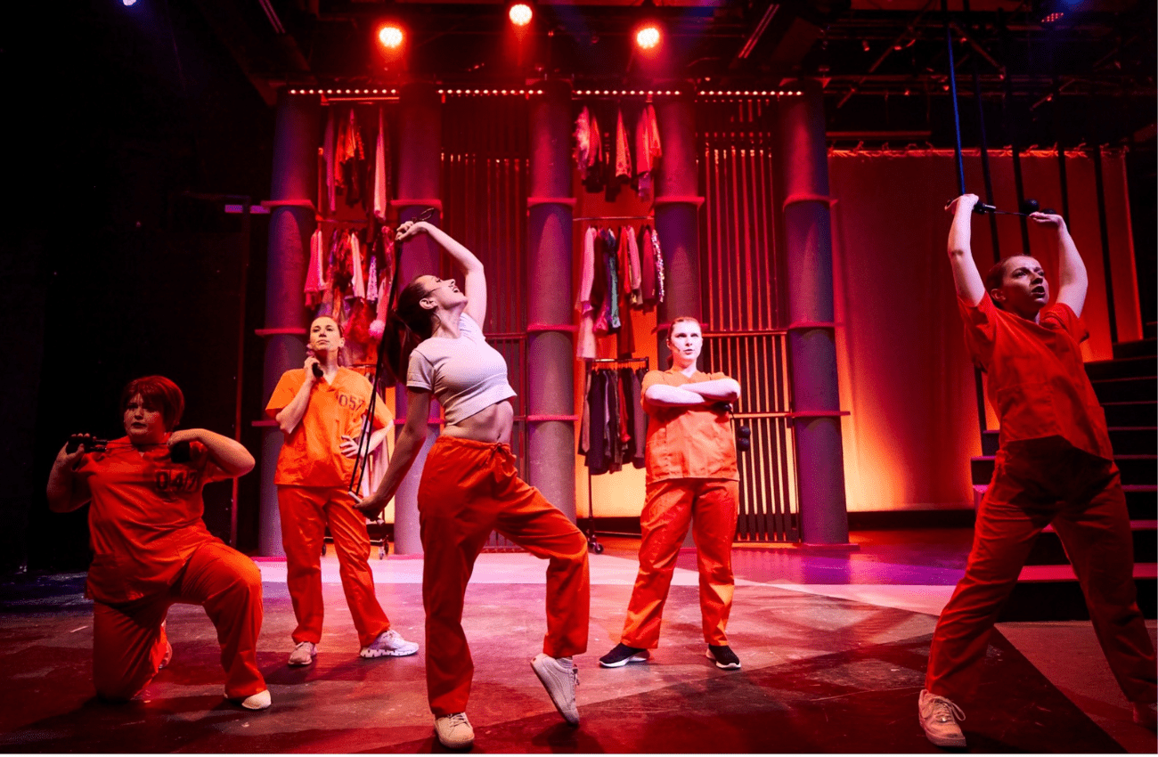 A group of young women on stage during a winter theatre production at SALT performing arts.