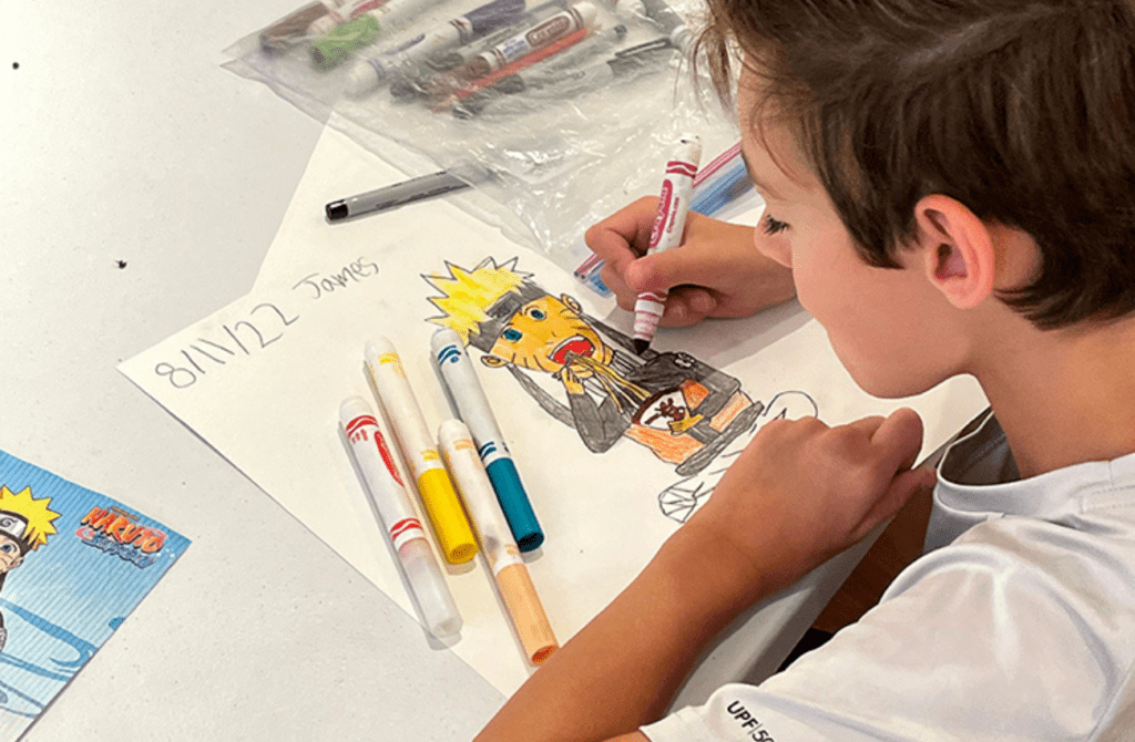 A boy is drawing at Wayne Art Center.