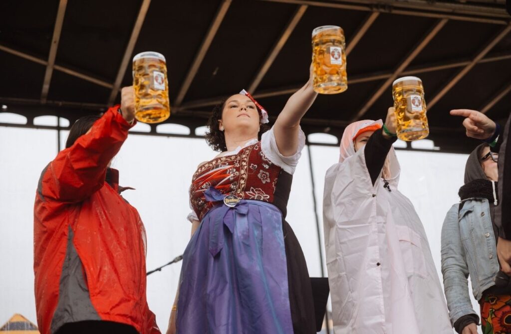 Women hold a liter mug of beer in the women's event in the Stein Hoist competition.