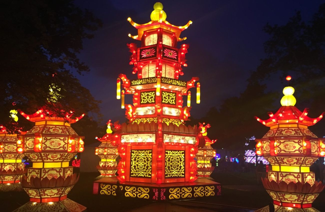 Red and yellow glowing pagodas at the Philadelphia Chinese Lantern Festival by Pamela Badolato.