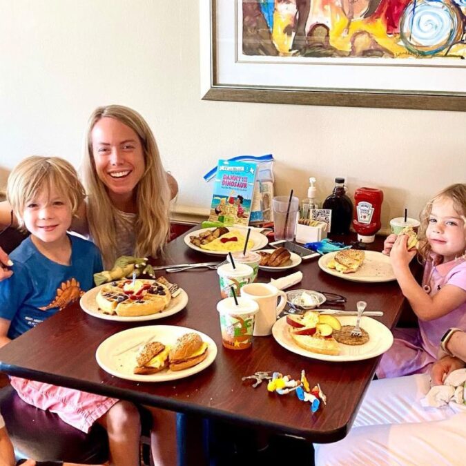 A mother, grandmother, and three little kids eat out for breakfast at Em J's Cafe in Berwyn.