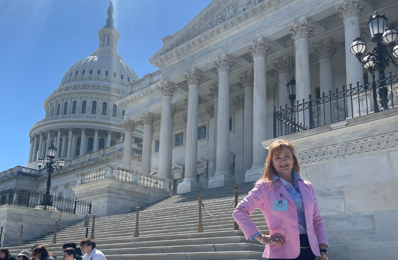 Kristin Meyer standing in front of the Capitol Building