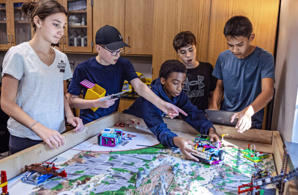 Friends central middle school students working on a robotics project