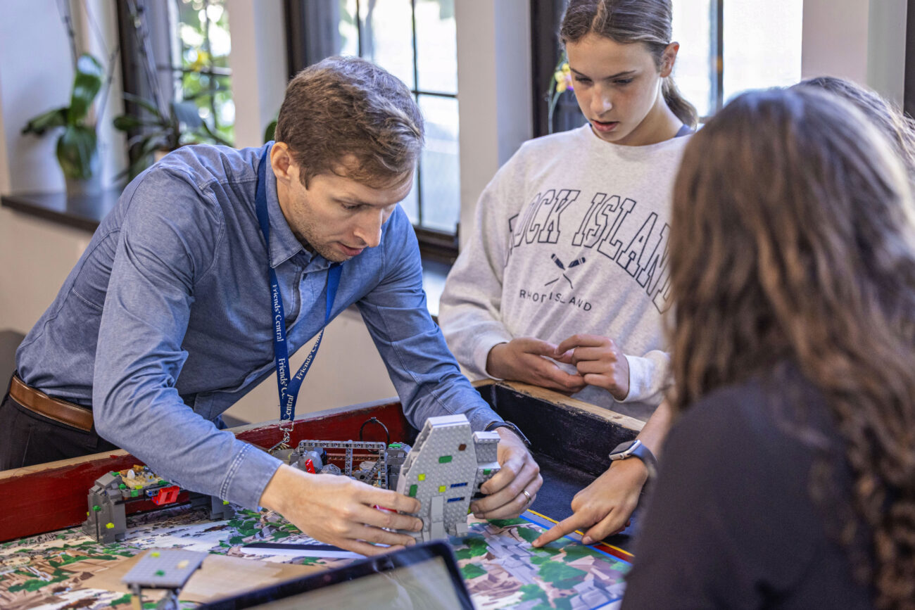 Friends Central School teacher helping the middle school robotics class