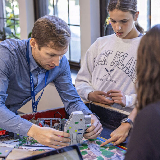 Friends Central School teacher helping the middle school robotics class