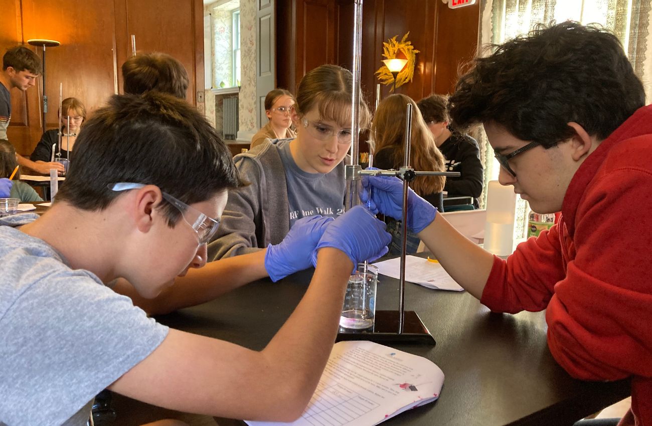 Three teens work together on a project at Cupola Academy in Malvern.