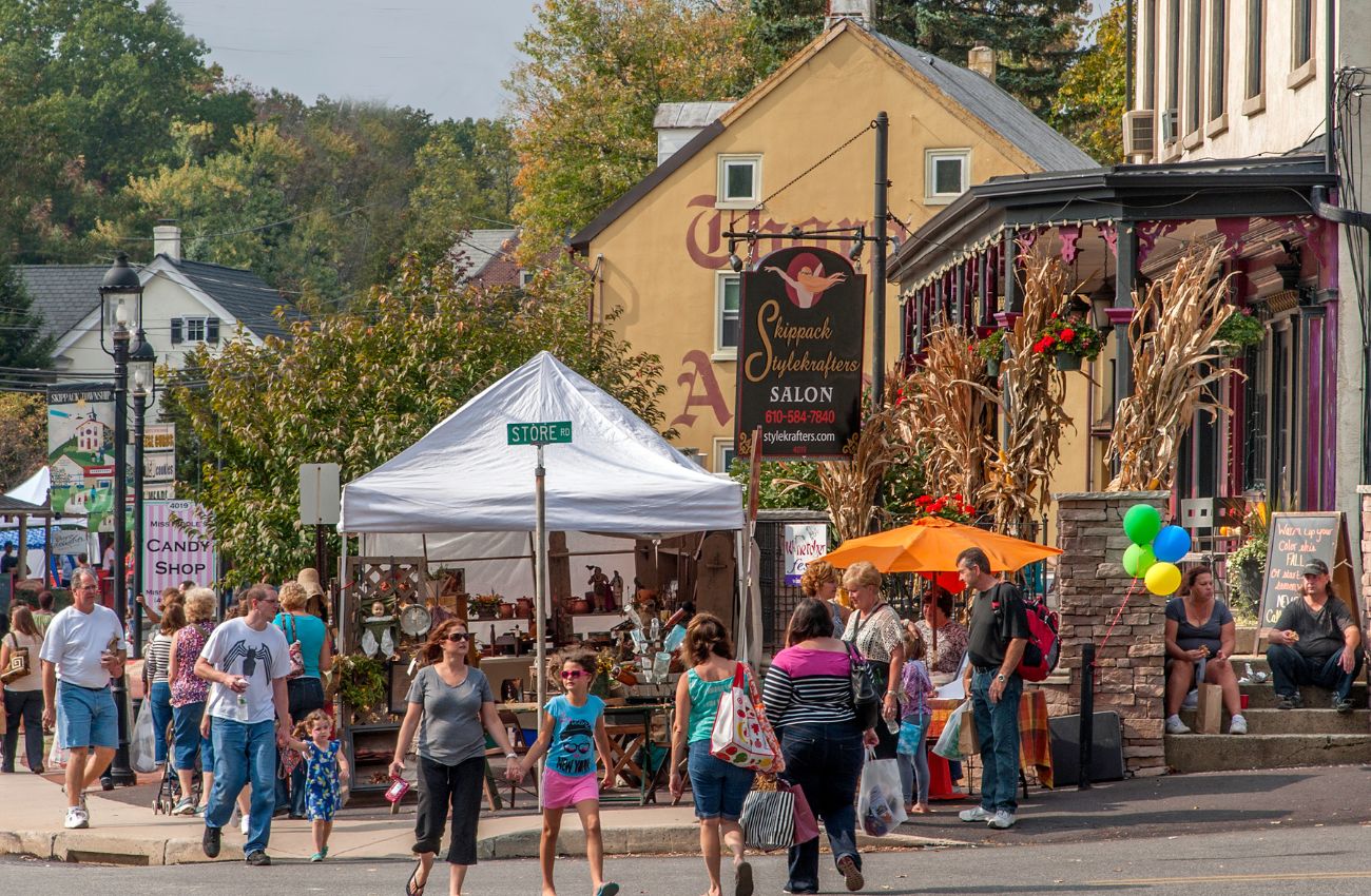 Skippack village filled with people on the street during a festival.