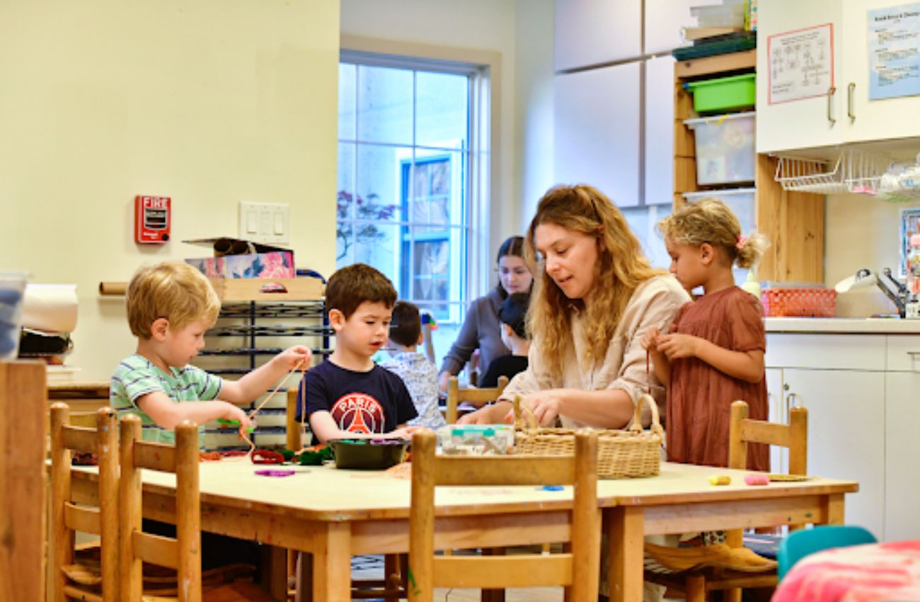 A Phebe Anna Thorne School educator engages a group of preschool children.