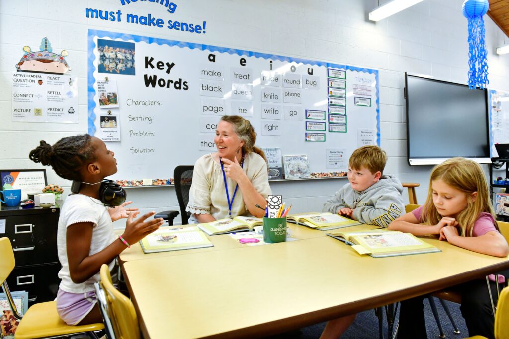 Campers spend mornings in individualized language arts sessions, with groups of 8–9 students led by 2–3 teachers.