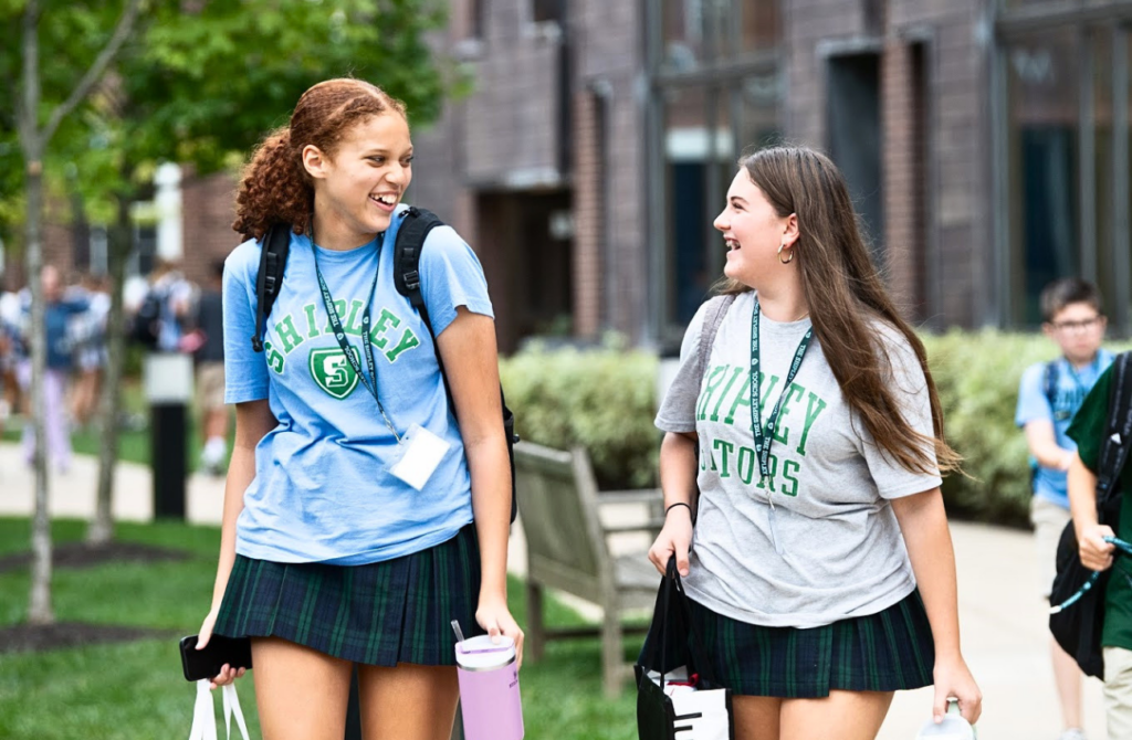Two teen girls walk on campus at the  Shipley School in Bryn Mawr, PA. 