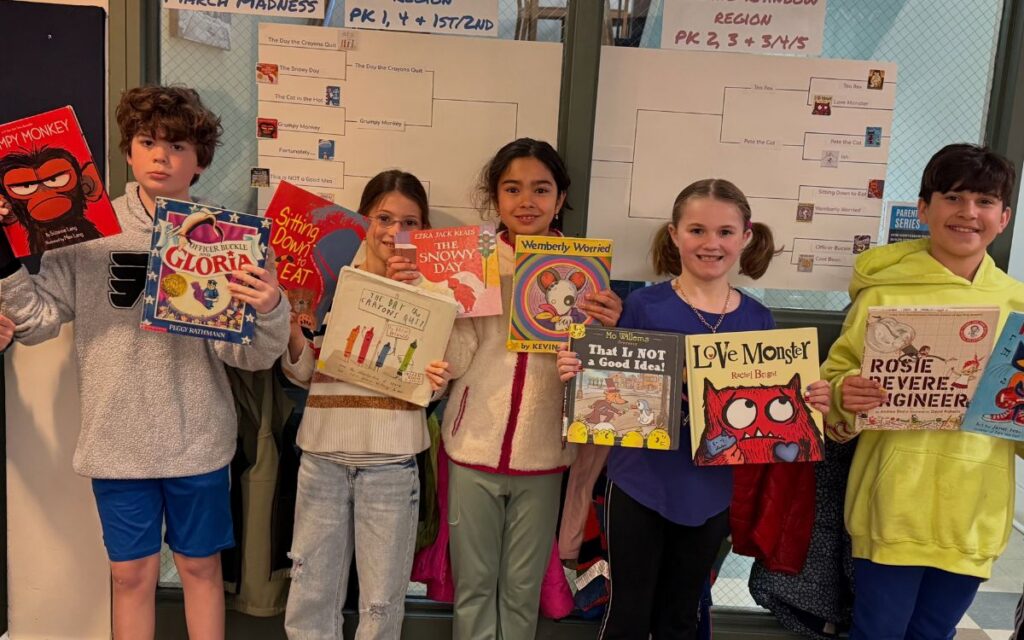 The Walden School children with books