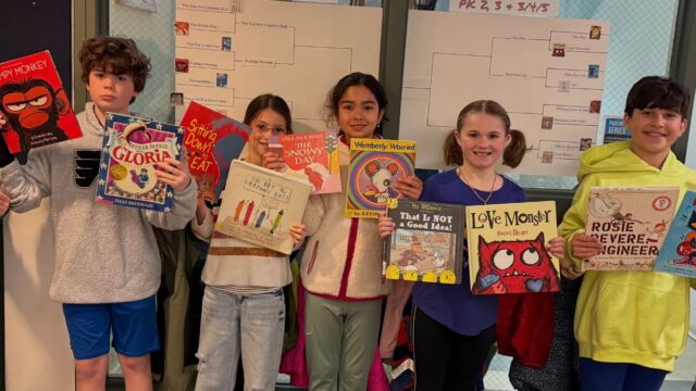 The Walden School children with books
