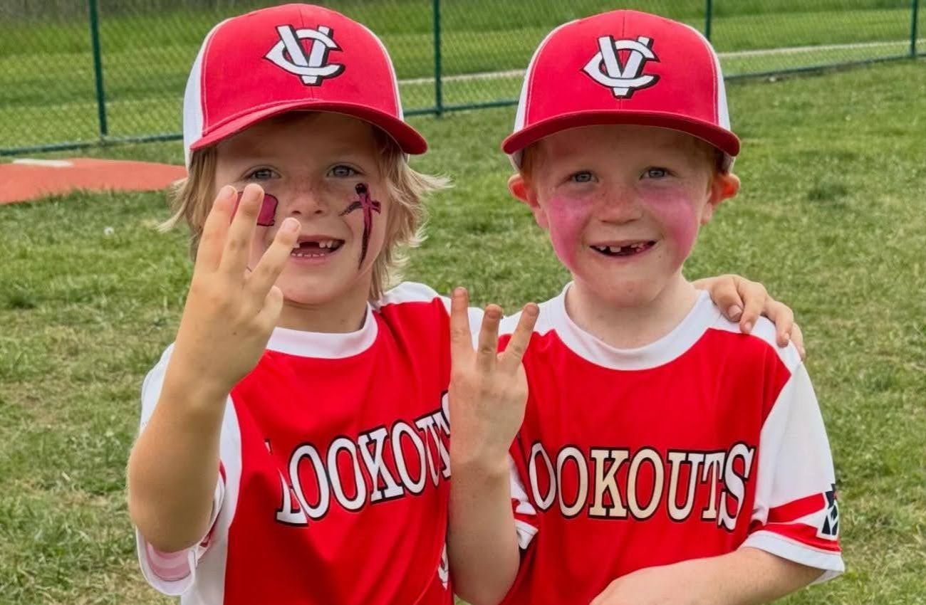 Two little boys wear red Chester County Little League uniforms as part of fall sports for preschoolers on the Main Line.