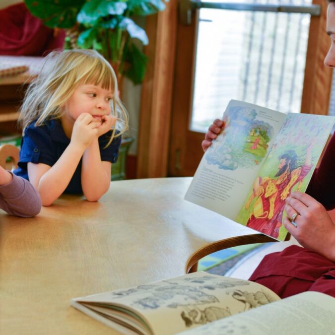 A Main Line Classical Academy reads a story to young children.