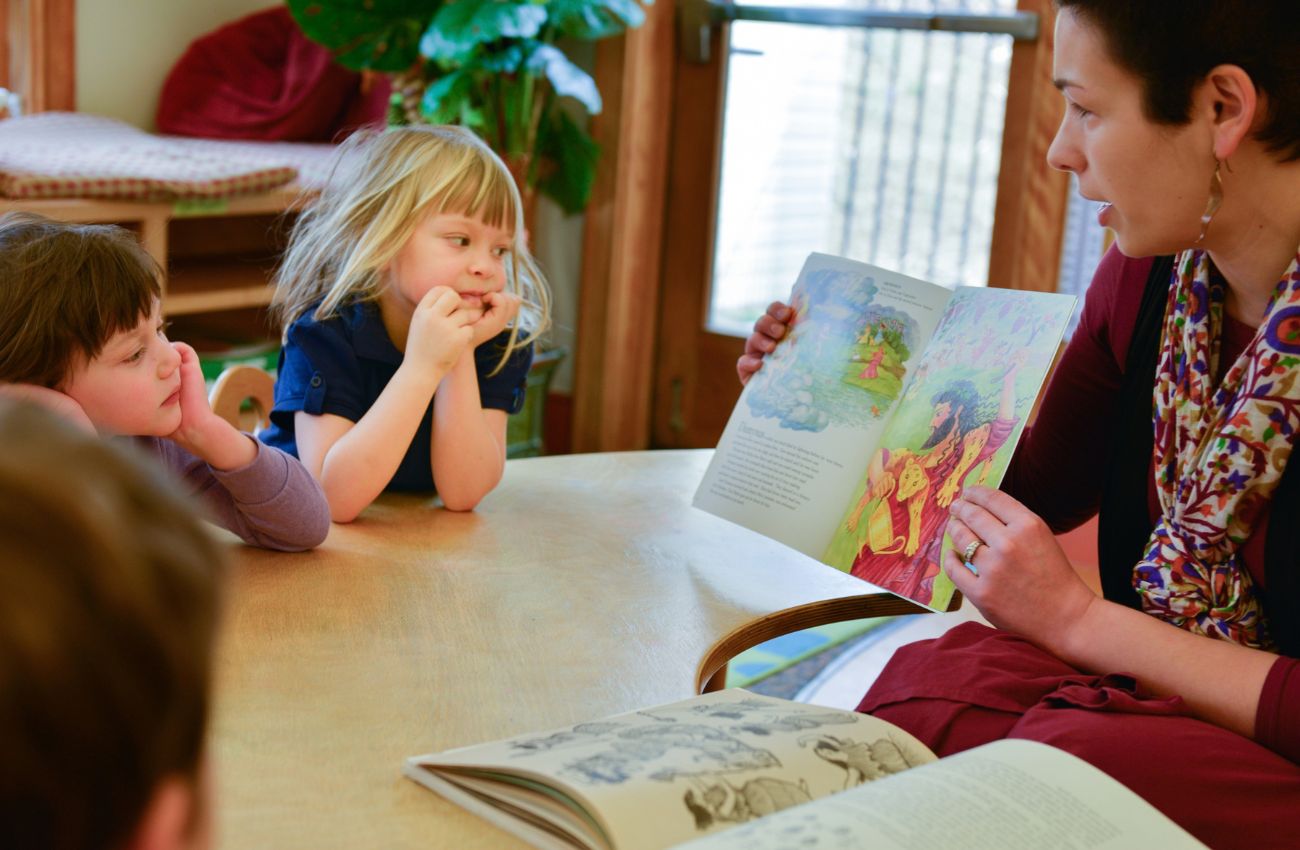 A Main Line Classical Academy reads a story to young children.